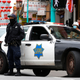 SAN FRANCISCO, CALIFORNIA - MARCH 17: A San Francisco police officer stands guard on Grant Avenue in Chinatown on March 17, 2021 in San Francisco, California.